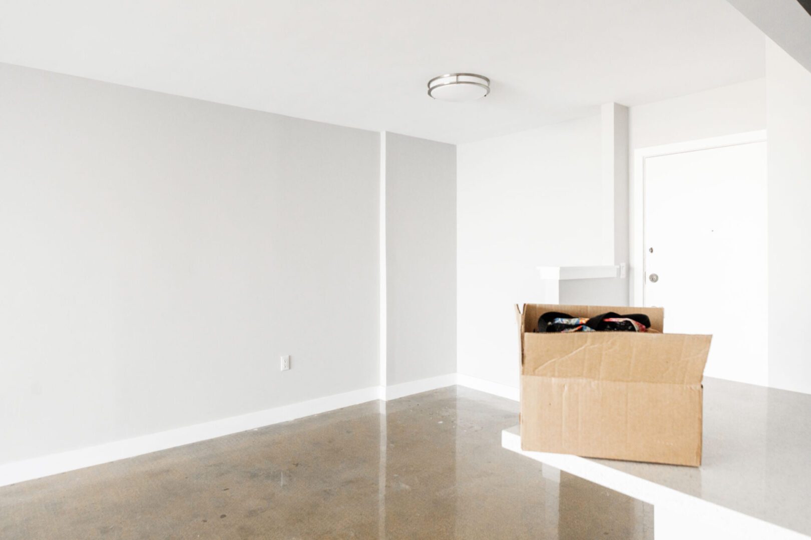 Empty room with a cardboard box.